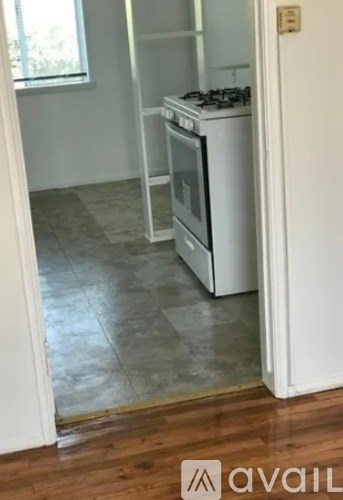 A kitchen with a stove and oven built into the cabinetry.