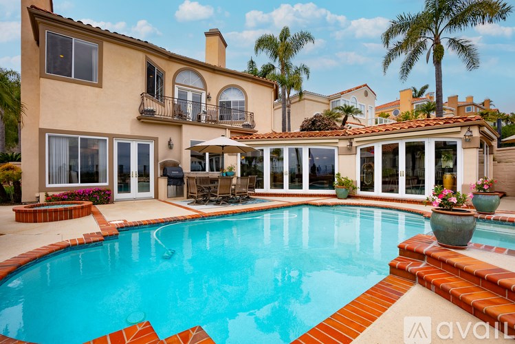 A large house with a pool in the backyard.