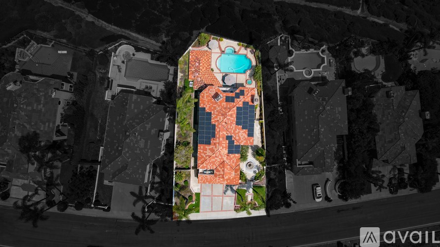 A bird's eye view of a building with a large orange and blue square in the center.