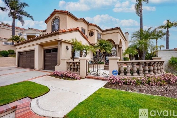 A house with a driveway and a sign that says "available".