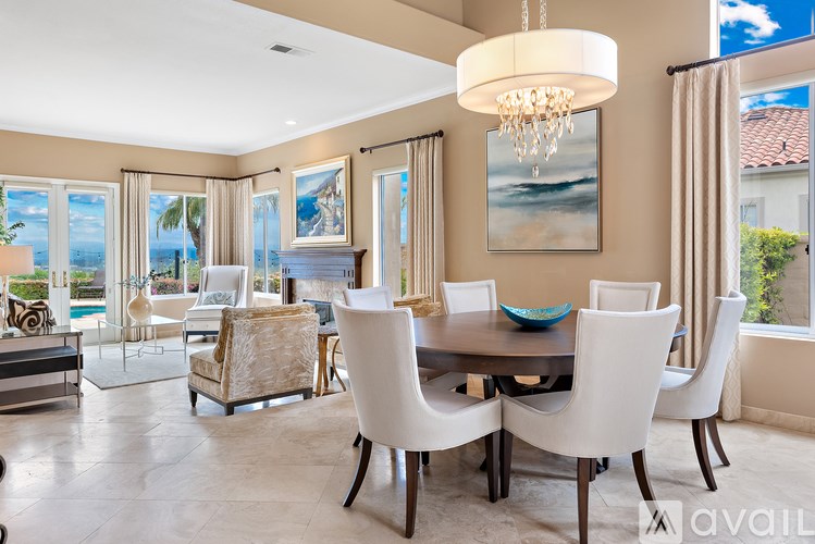 A dining room with a table set for six.