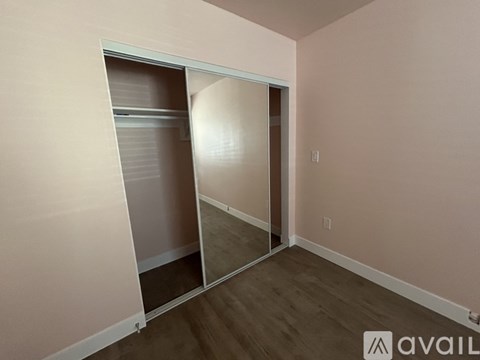 A room with a washer and dryer stacked on top of each other.