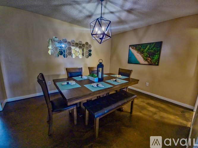 A dining room with a wooden table and benches.