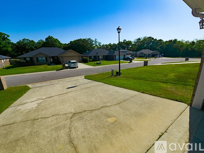 A residential area with houses and a street light.