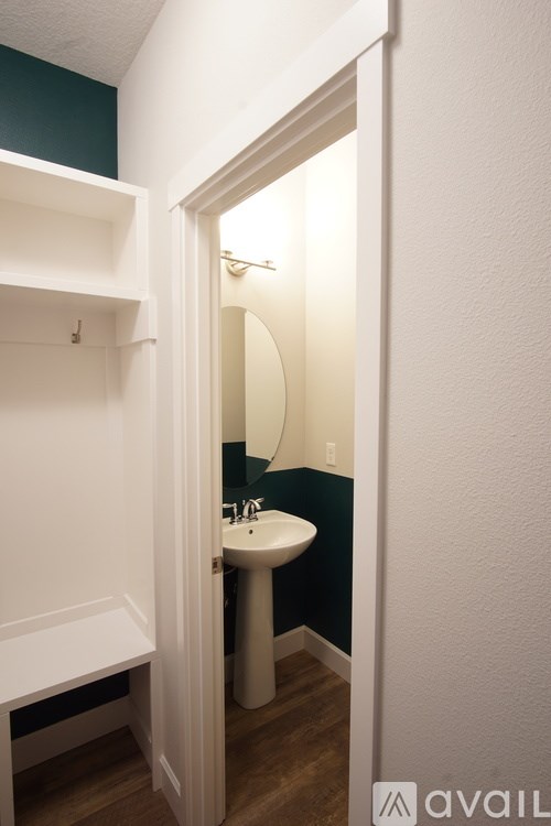 A bathroom with a sink and mirror.