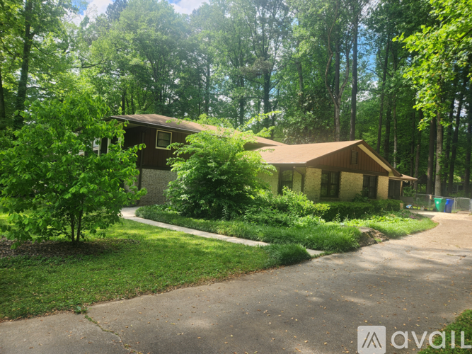 A house surrounded by greenery and trees.