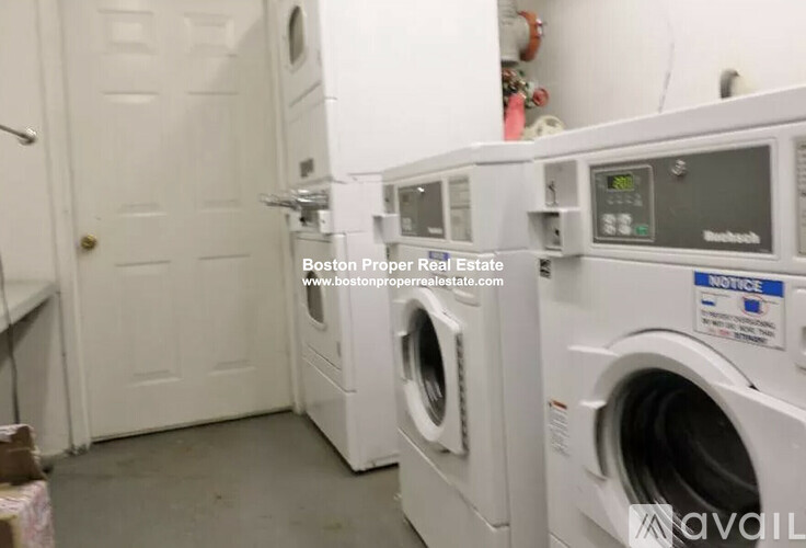 A laundry room with a washer and dryer.