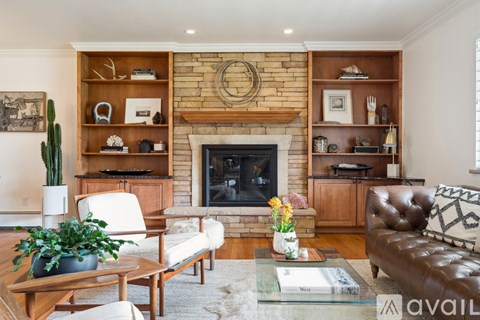 A living room with a fireplace and a couch.