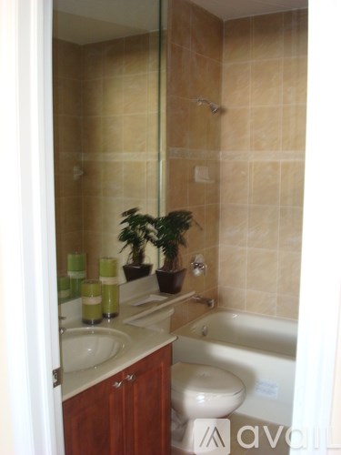 A bathroom with a sink, toilet, and bathtub.