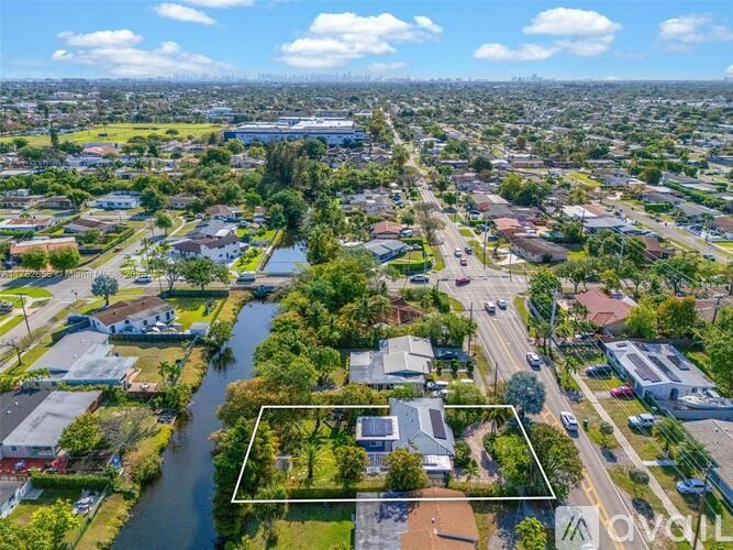 A bird's eye view of a city with a river running through it.