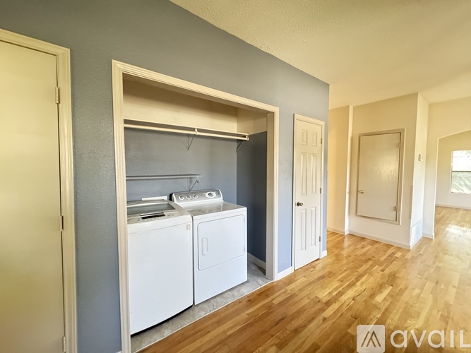 A laundry room with a washer and dryer in it.