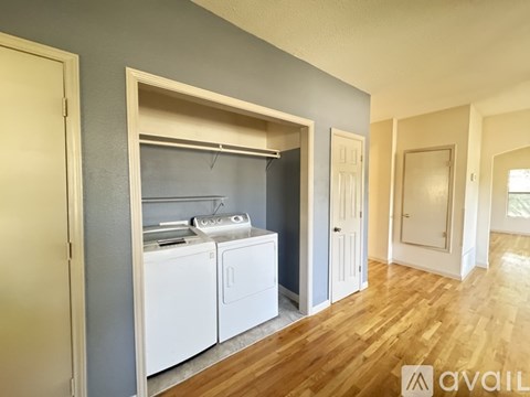 A laundry room with a washer and dryer in it.