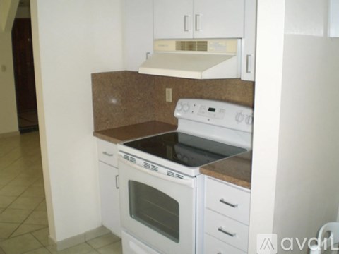 A white oven and microwave in a kitchen.