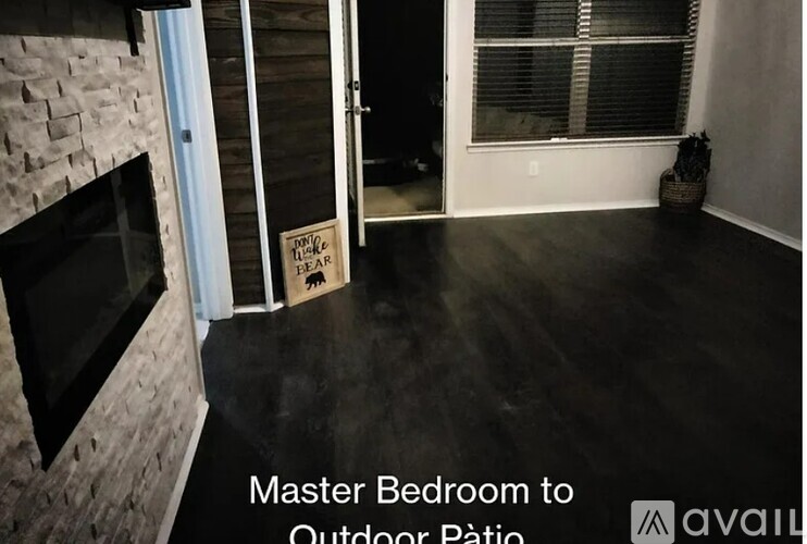 A sign on a doorway reads "Master Bedroom to Outdoor Patio.".