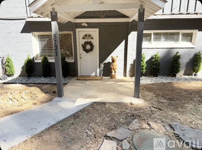 A house with a blue exterior and a white door is available for purchase.