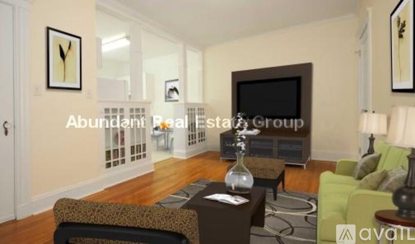 A living room with a couch, chair, and a coffee table.