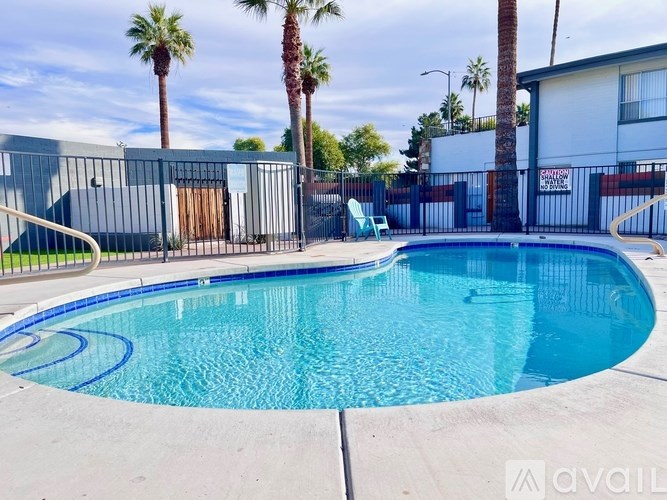 A pool surrounded by a fence with a sign that says "Available".