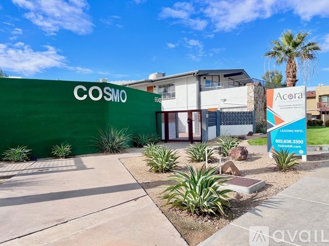 A green wall with the word COSMO on it.