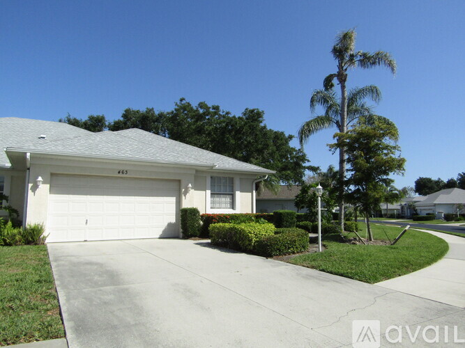 A house with a white garage door is for sale.