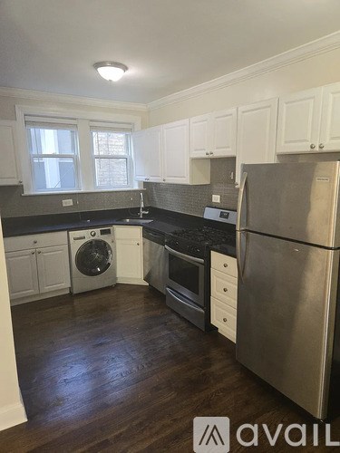 A kitchen with a stainless steel refrigerator, dishwasher, and oven.