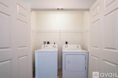 A room with a window and a door is available for rent.
