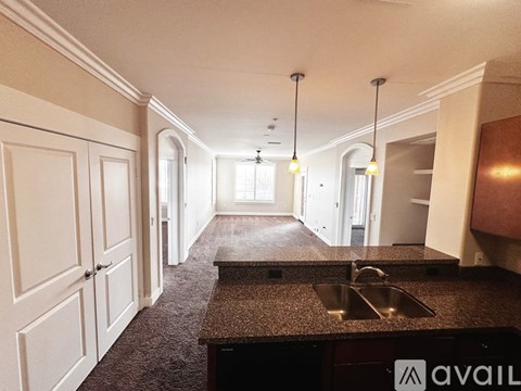A kitchen with a sink and cabinets.