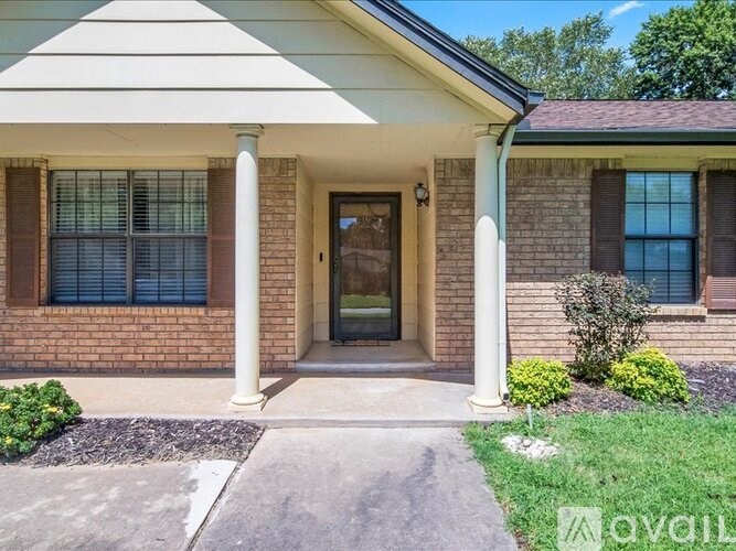A house with a front porch and a covered entrance.