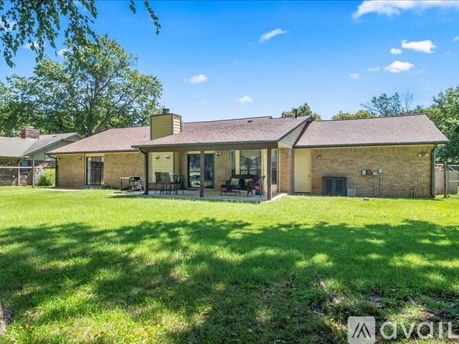 A house with a lawn in front of it.