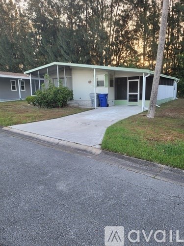 A house with a driveway in front of it.