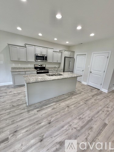 A kitchen with a countertop and cabinets.