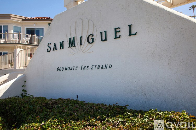 A white wall with San Miguel written on it.