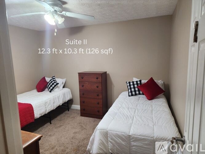 A bedroom with two beds and a dresser is labeled as Suite II, measuring 12.3 ft x 10.3 ft.