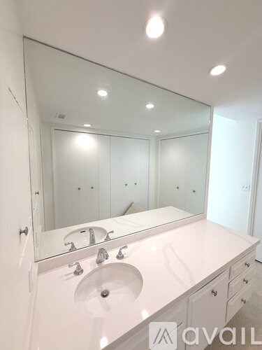 A pool with a view of a city at night.