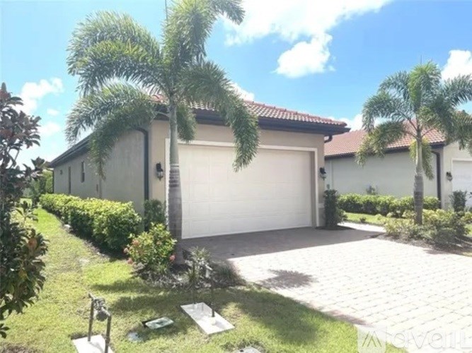 A house with a white garage door and a driveway.