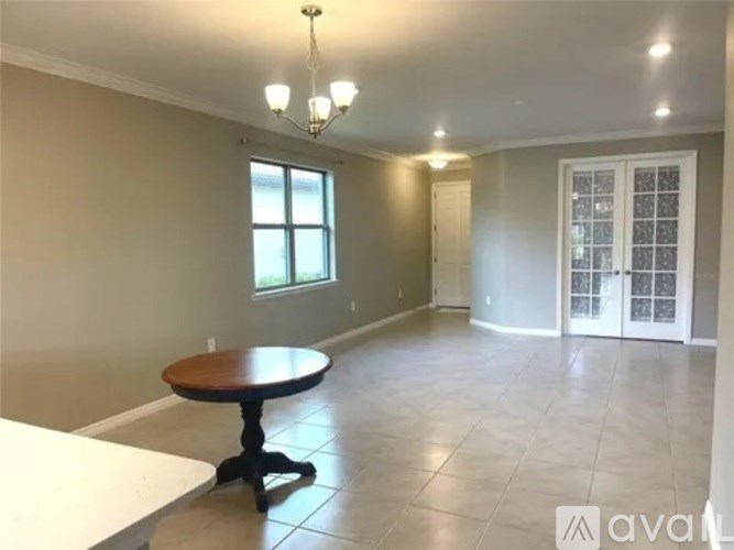 A room with a table and chairs in it.