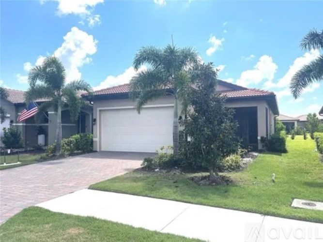 A house with a garage and a driveway.