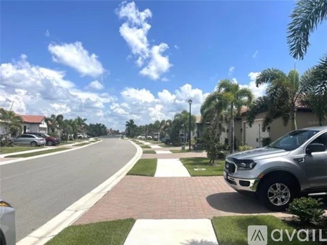 A silver truck is parked on a residential street.
