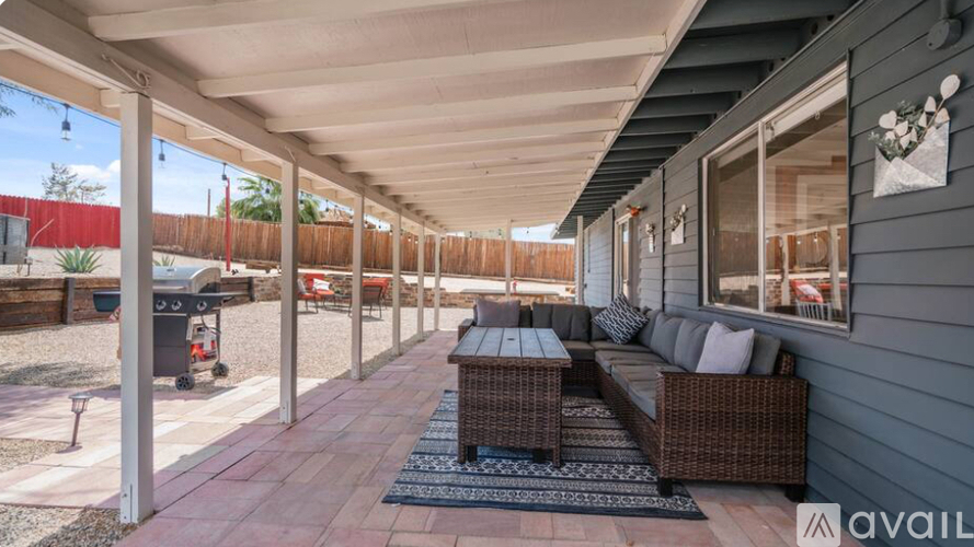 A patio with a table and chairs is available for rent.