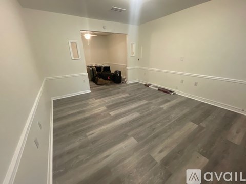 A living room with a couch and a chair.