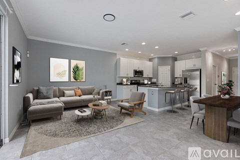 A modern living room with a grey sofa and a coffee table.
