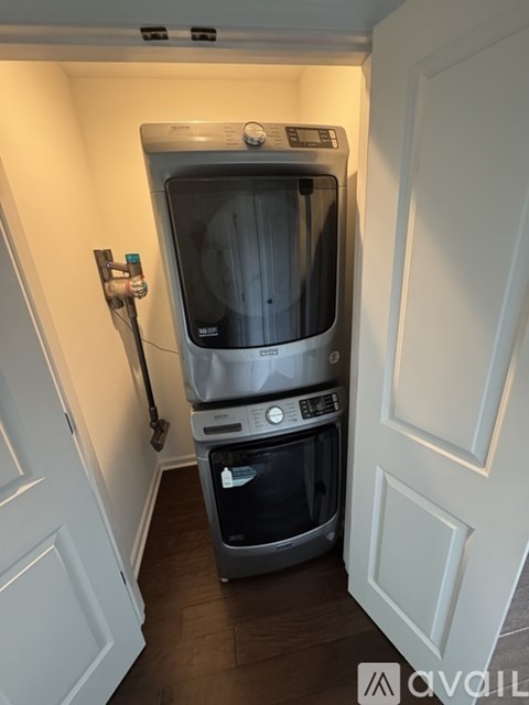 A small kitchen with a dishwasher and a washing machine.