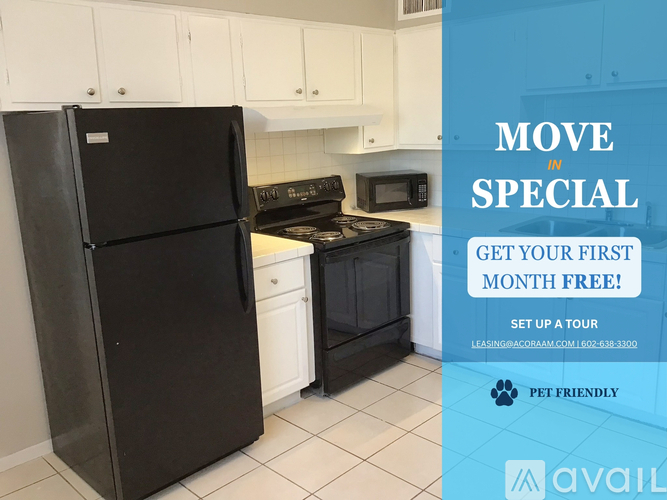 A kitchen with a refrigerator, stove, and microwave is on sale for the first month free.