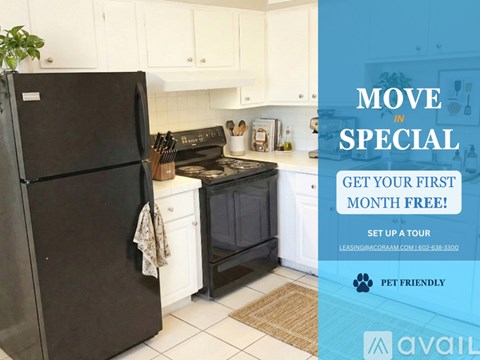 A kitchen with a refrigerator, stove, and microwave is on sale for the first month free.