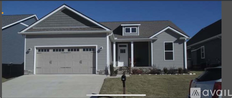 A two-car garage is attached to a house.