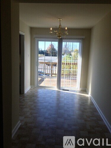 A room with a checkered floor and a chandelier.