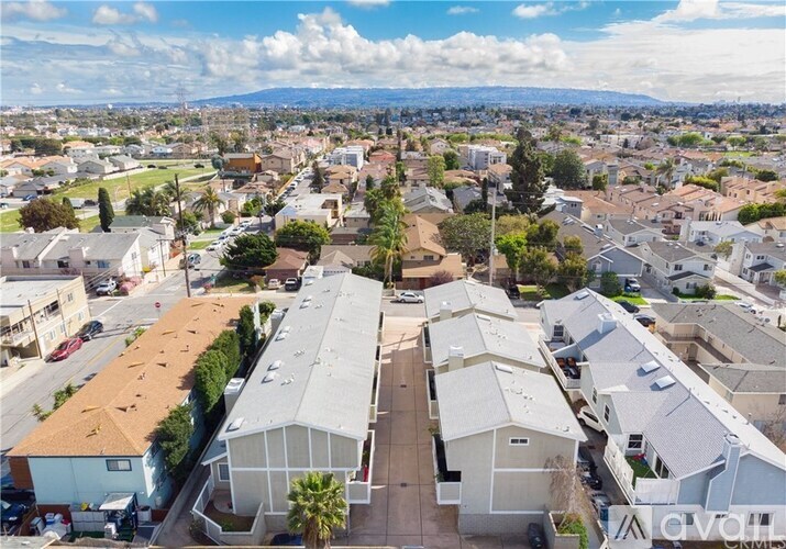 A bird's eye view of a residential area with houses and apartment buildings.