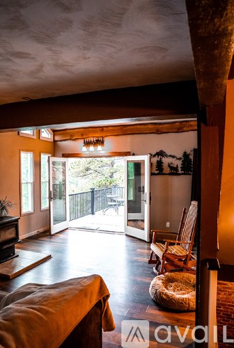 A living room with a couch and a chair.