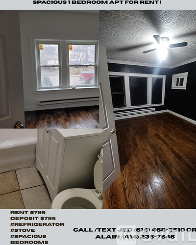 A dark brown wooden floor with a reflection of a light source.