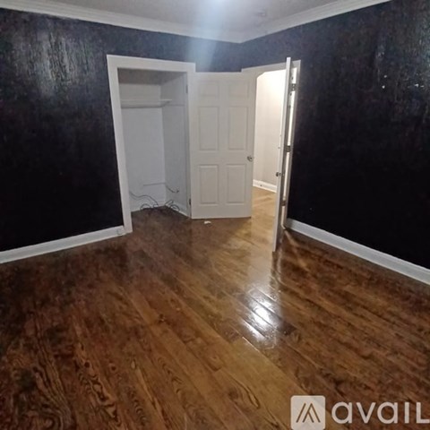 A white bathroom with a hole in the wall.