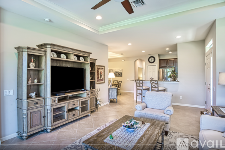 A living room with a large entertainment center and a couch.